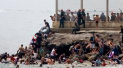 Spain sending troops as thousands enter enclave of Ceuta from Morocco